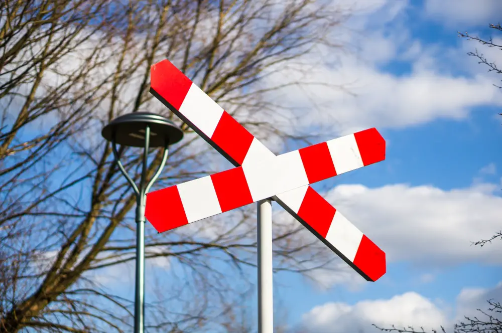 railway crossing sign to warn people and trains