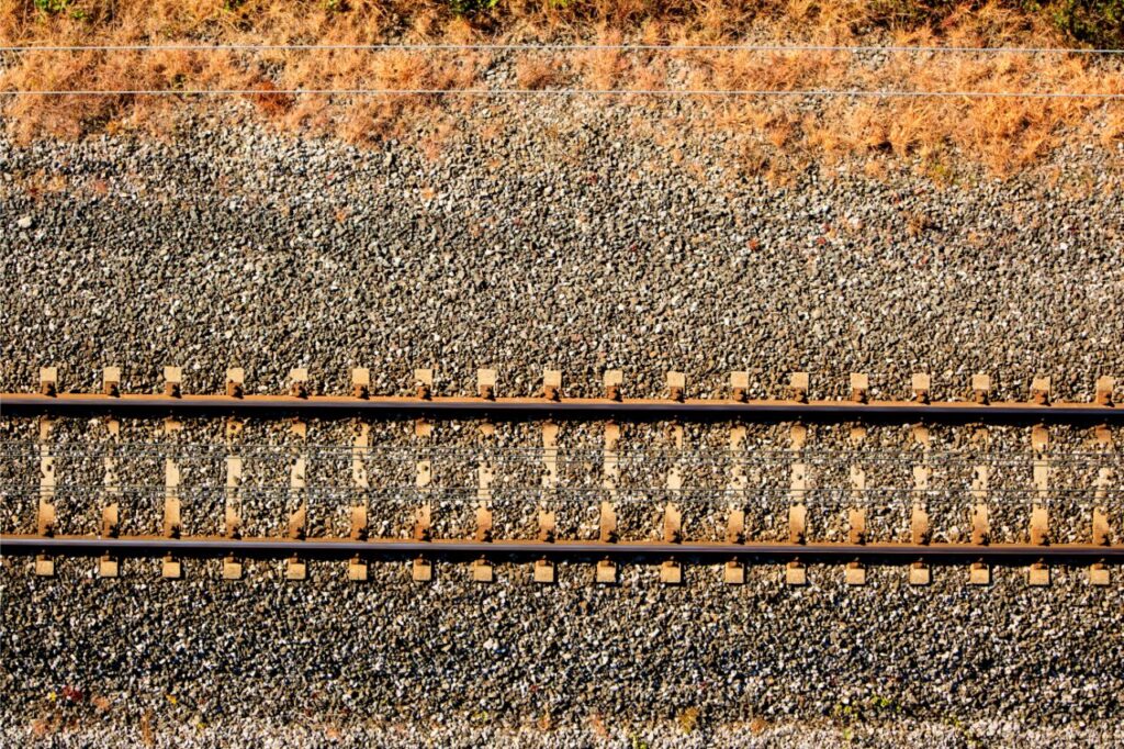single train track with railroad ties and railway spikes