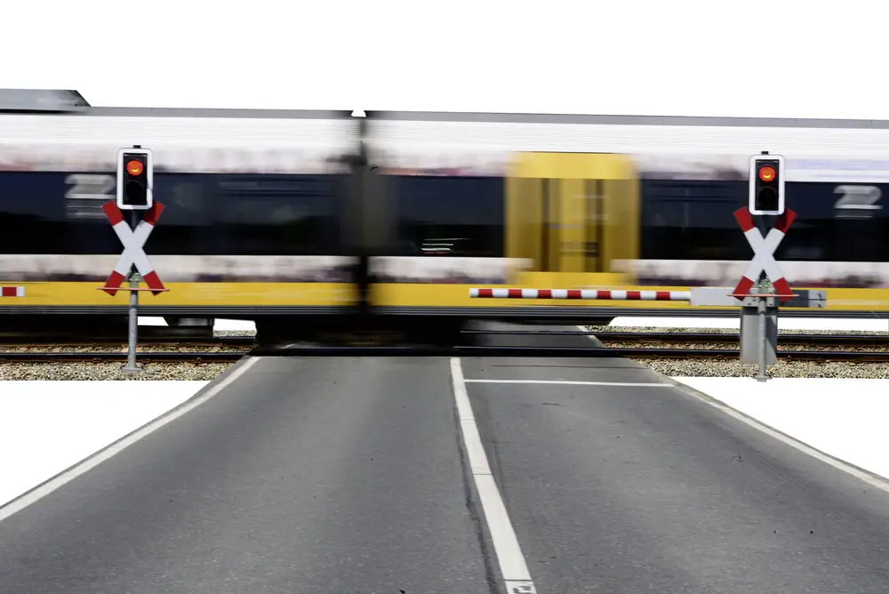 train going fast over a railroad crossing